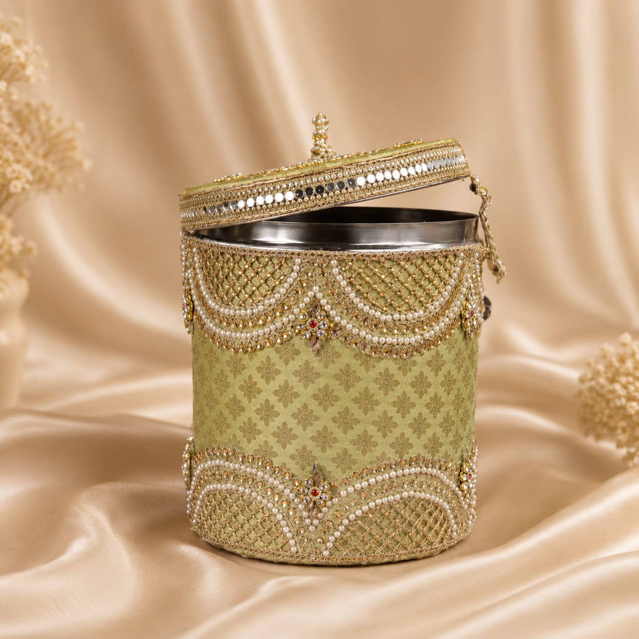 Sage green pearl embellished round dabba with gold zari and hinged lid